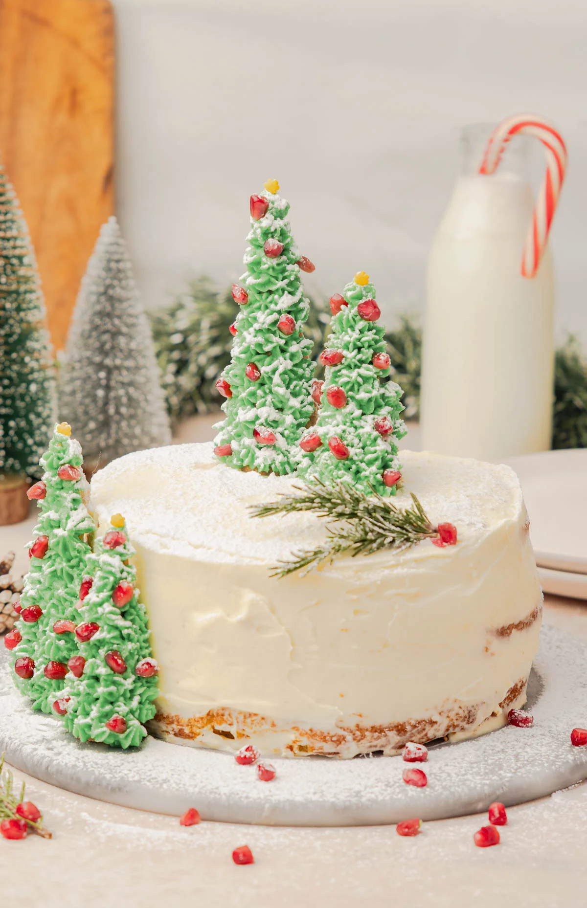 christmas cake with minimal icing and decorated edible christmas trees