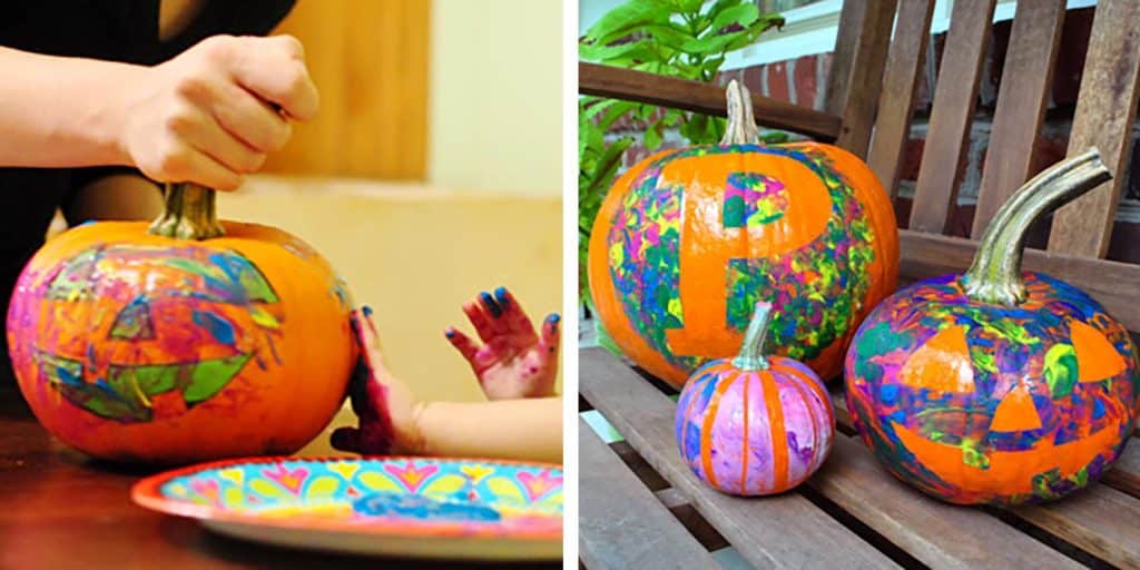 kid friendly pumpkin decorating idea with finger painting over painters tape stencil