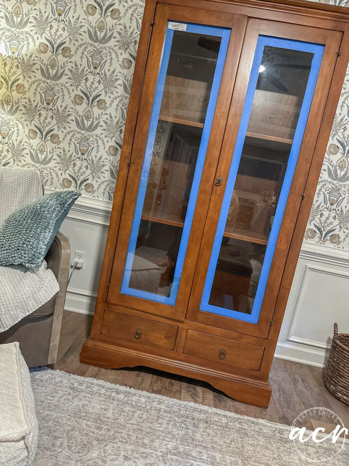paint a wood look finish 2 cabinet taped up around glass