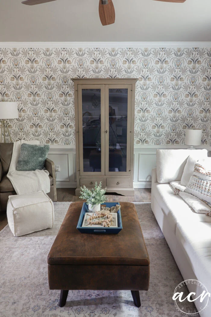 paint a wood look finish 15 finished cabinet in room with ottoman and couch