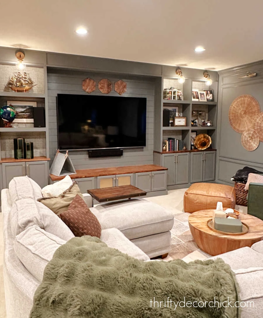 dark gray wall of bookcases with tv