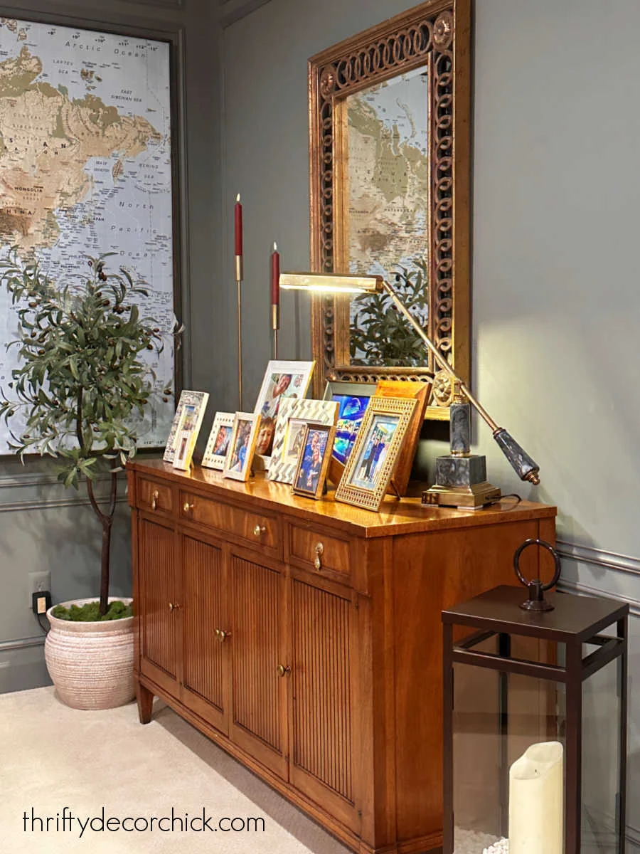 rearranging our basement family room prep for the holidays thrifty decor chick 6 framed photos with lamp on dresser