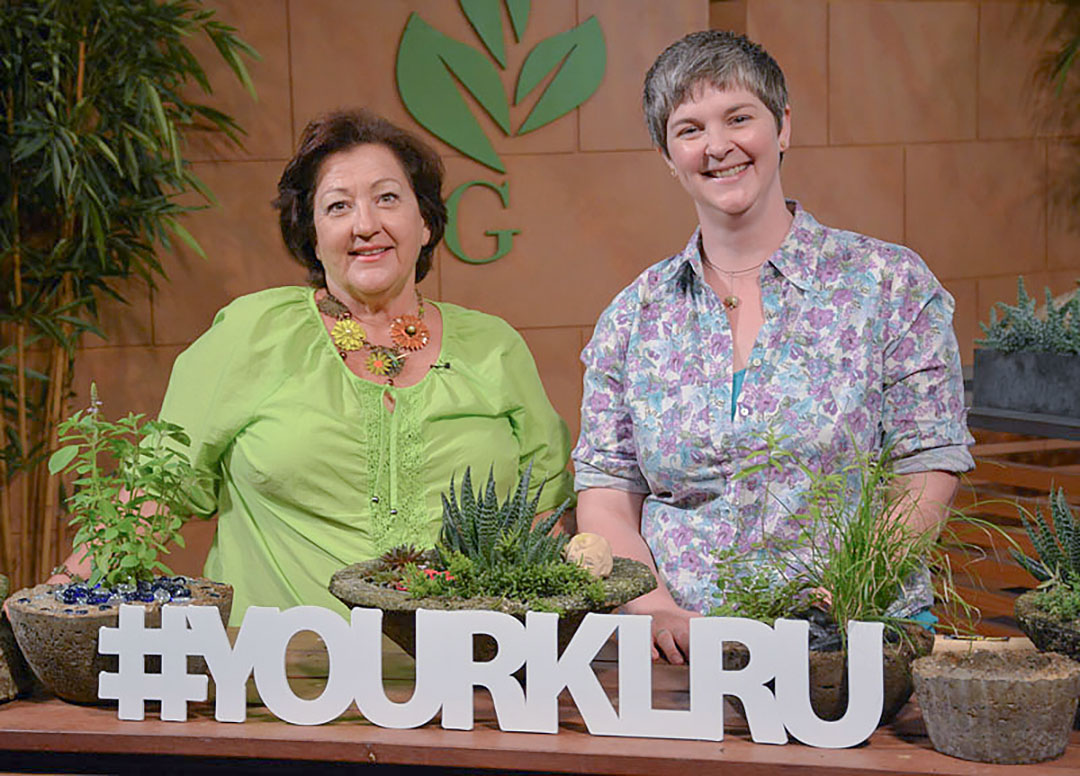 30 seasons and countless memories 28 2 women at studio table with containers of plants and #yourklru cut out letters in front