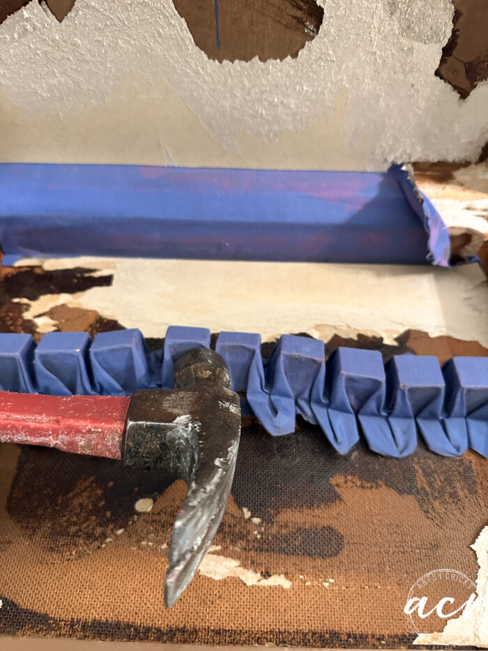 hammering away the silver holder