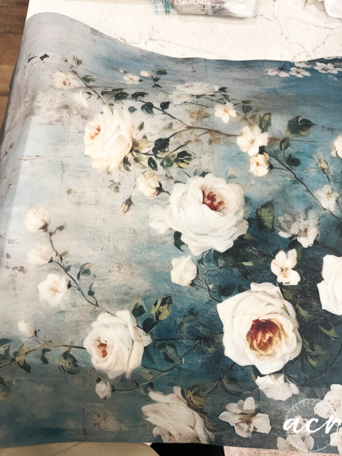 blue tissue paper with white roses