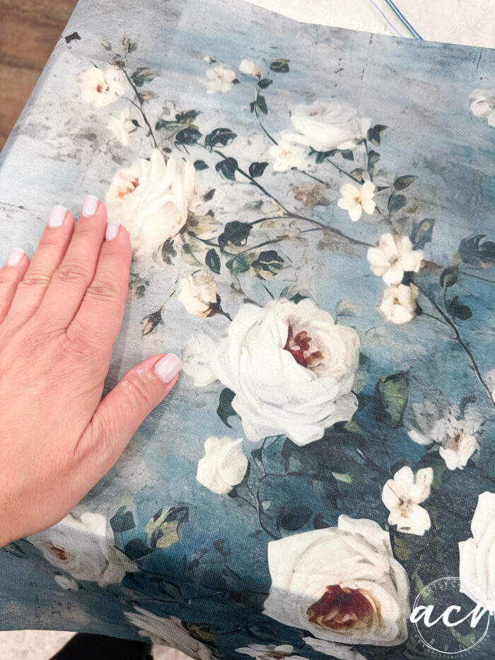 applying tissue paper on top of box