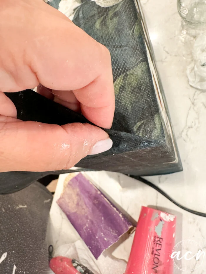 holding up excess paper at corners