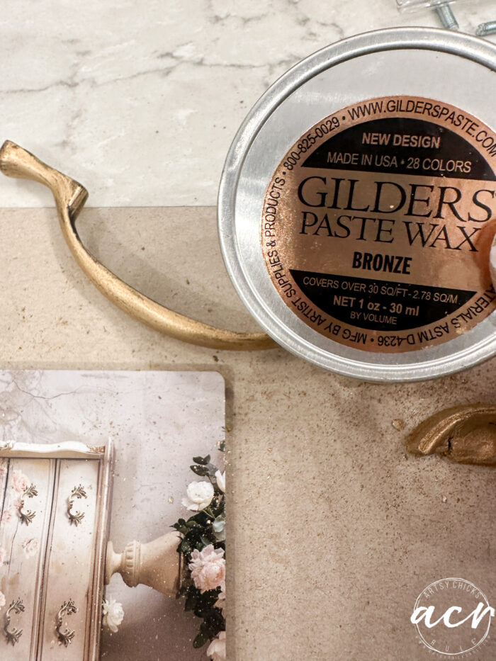 gold handle with gilder's paste beside it