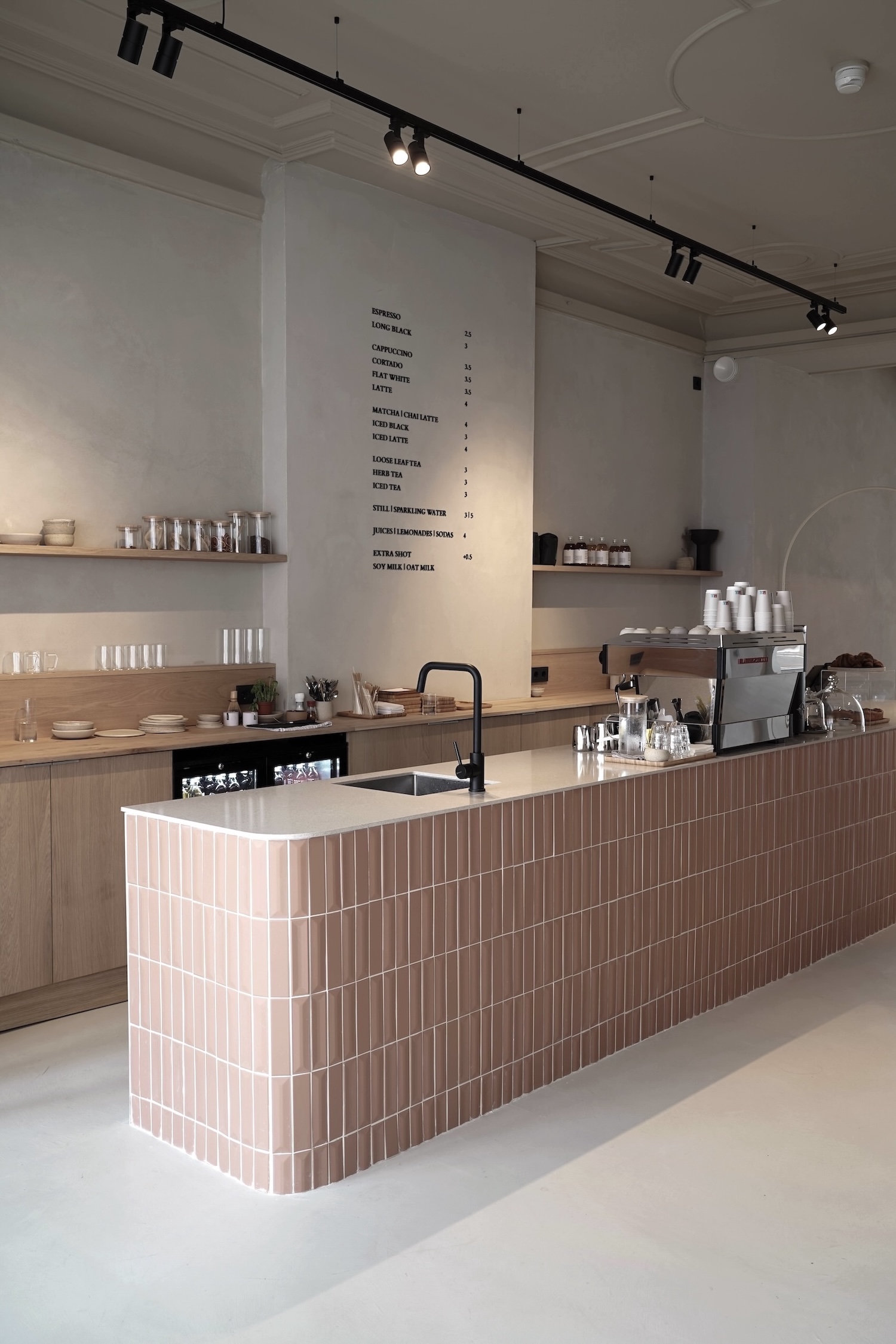 the ground floor café serves as the gathering spot for guests and locals. the  18