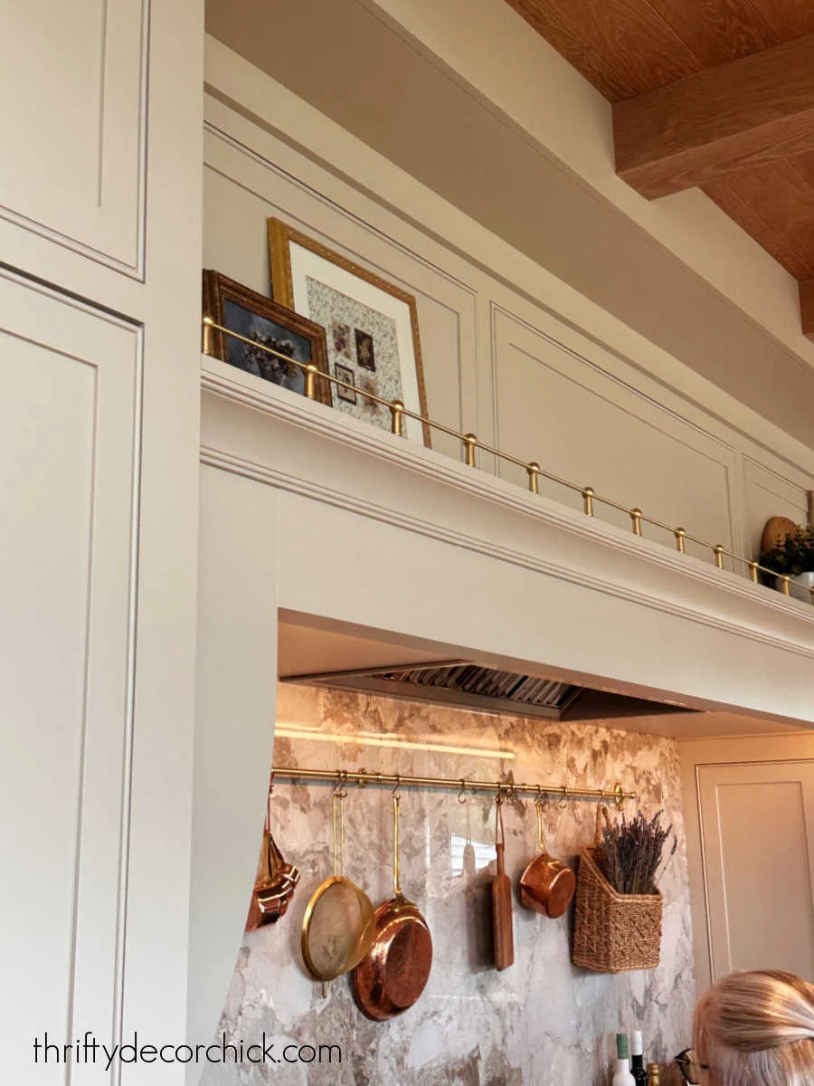 brass decorative rail above stovetop