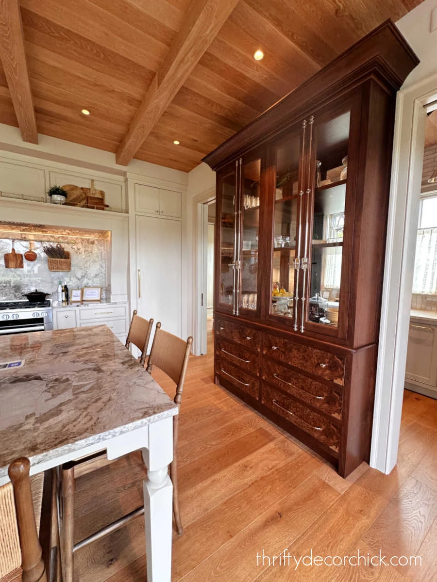 burled wood armoire in kitchen