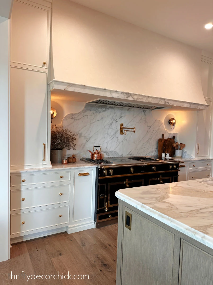 round sconces above stovetop