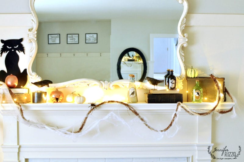 halloween mantel decor with pumpkins, spiders and more 3 halloween mantel decor and fairy lights including vintage bottles, a black can and small pumpkins