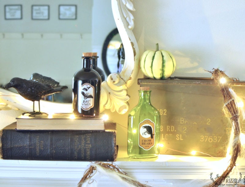 halloween mantel decor with pumpkins, spiders and more 7 fun halloween mantel decor with glass halloween bottles