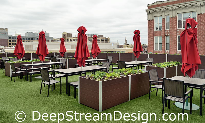 large rectangular planters growing produce on fenway stadium strega deck