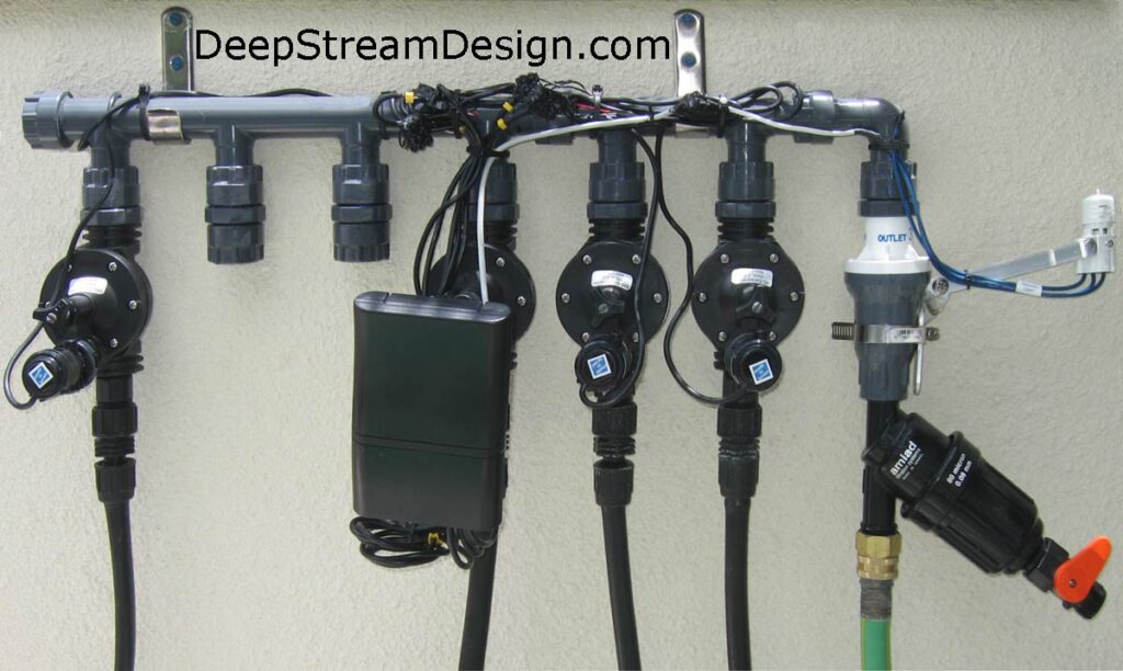 automatic drip irrigation manifold with rain sensor and 4 active zones.  click pic to link to dripworks website for more information.