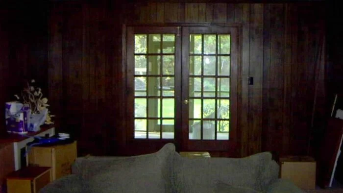 evolution of a living room 14 dark paneled walls with french doors