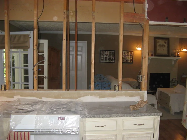 evolution of a living room 20 kitchen wall looking into living room with only studs