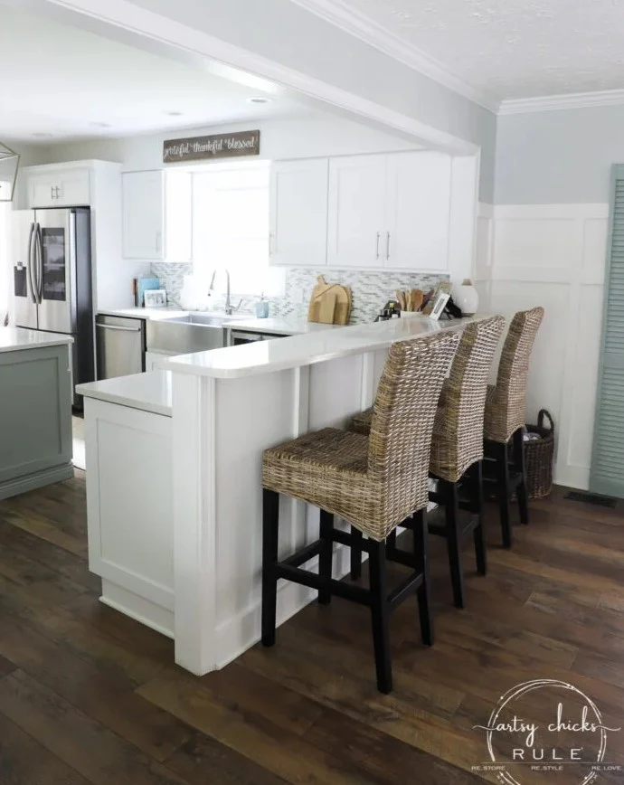 evolution of a living room 21 same kitchen wall not half gone and bar top instead with chairs open to kitchen
