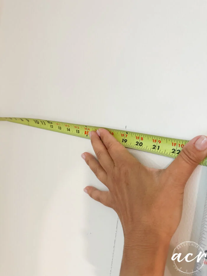 hanging prepasted strippable wallpaper artsy chicks rule 1 using tape measure to measure wall