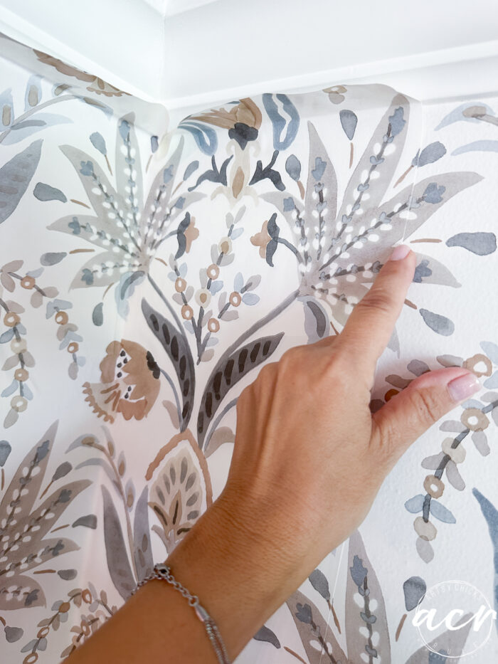 hanging prepasted strippable wallpaper artsy chicks rule 9 pointing to the seam