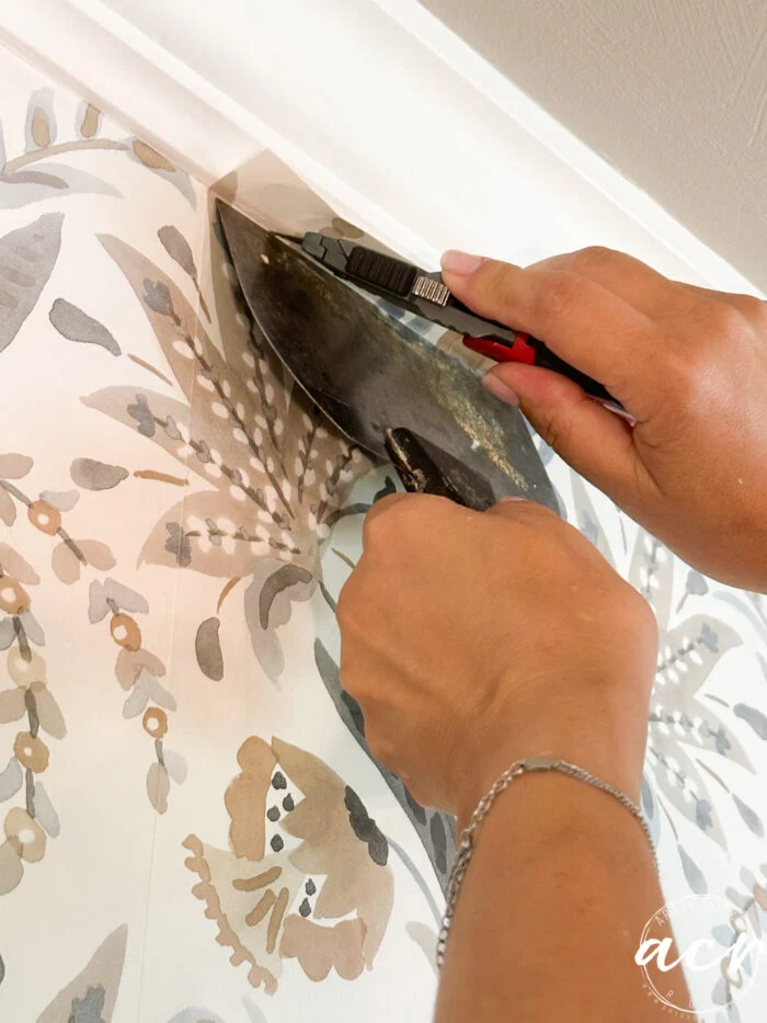 hanging prepasted strippable wallpaper artsy chicks rule 11 using putty knife and razer to cut excess