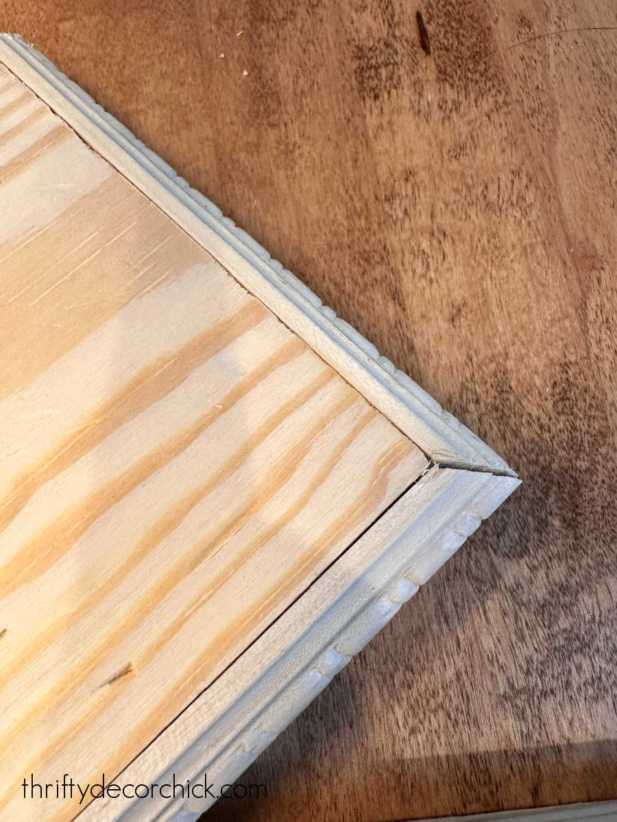 mitered trim on wood board