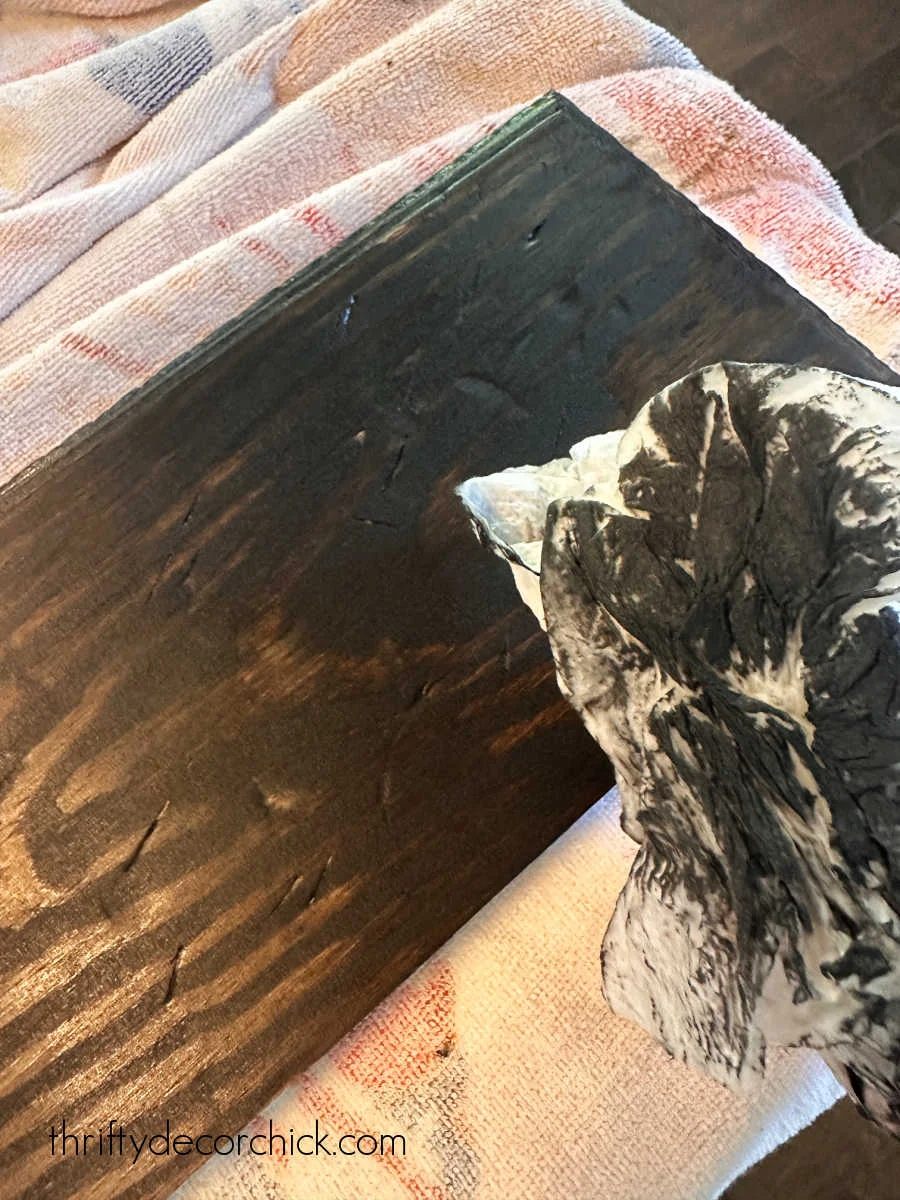 black paint wash on stained wood