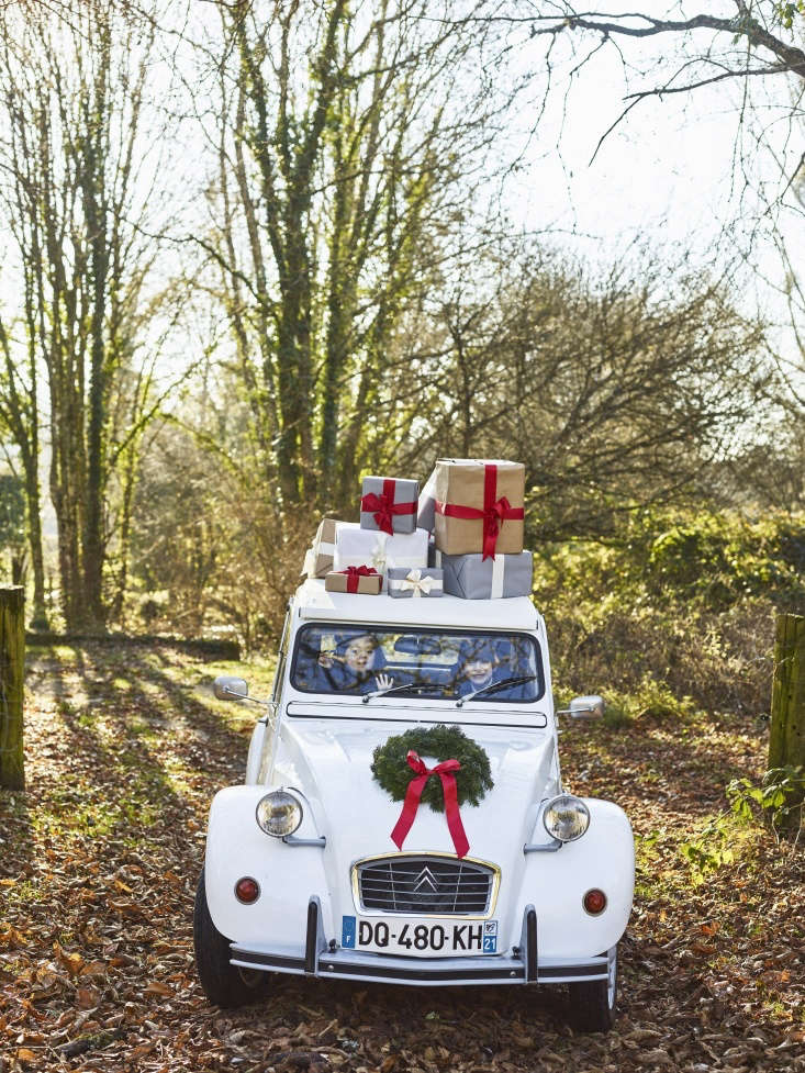 got a car in the driveway you only occasionally drive? incorporate it into your outdoor holiday design. photograph by anson smart, courtesy of the cook’s atelier, from christmas in burgundy: at home with the expat family behind the cook’s atelier.
