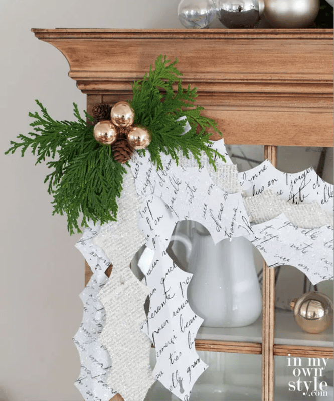 amazing and easy christmas craft paper ideas 8 paper holly and mistletoe garland with ornaments in a swag on a hutch