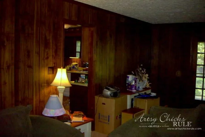 evolution of a living room 19 dark paneled wall with door opening