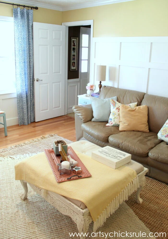 evolution of a living room 2 living room with yellow and white walls, light colored rug with blue curtains