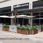 restaurant planters with signage