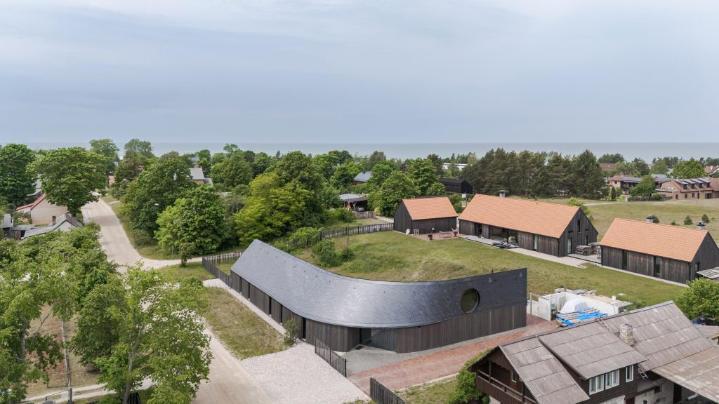 Twisting slate roof tops The Pavilosta House by Made in Latvia