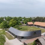 Twisting slate roof tops The Pavilosta House by Made in Latvia