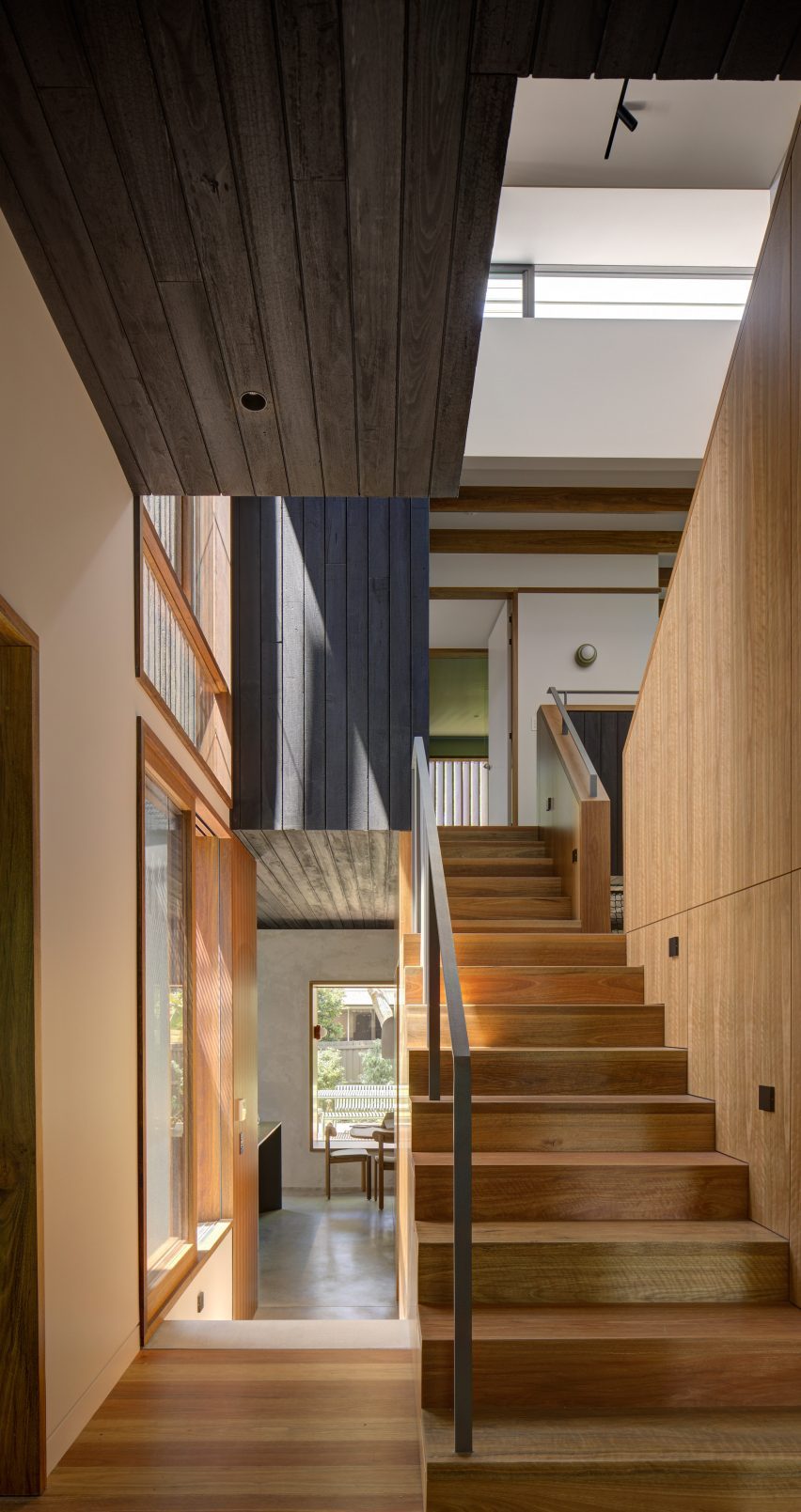 timber staircase with void above