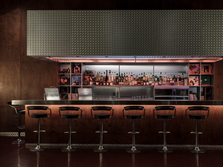 metal bar with high bar stools