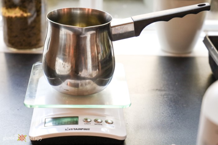 weighing oils and butters over kitchen scale