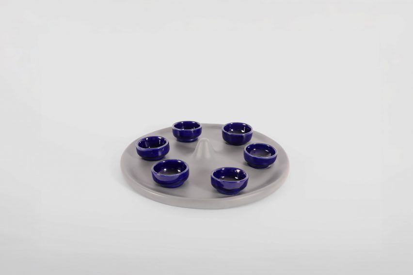 a photograph of small blue bowls on a silver dish