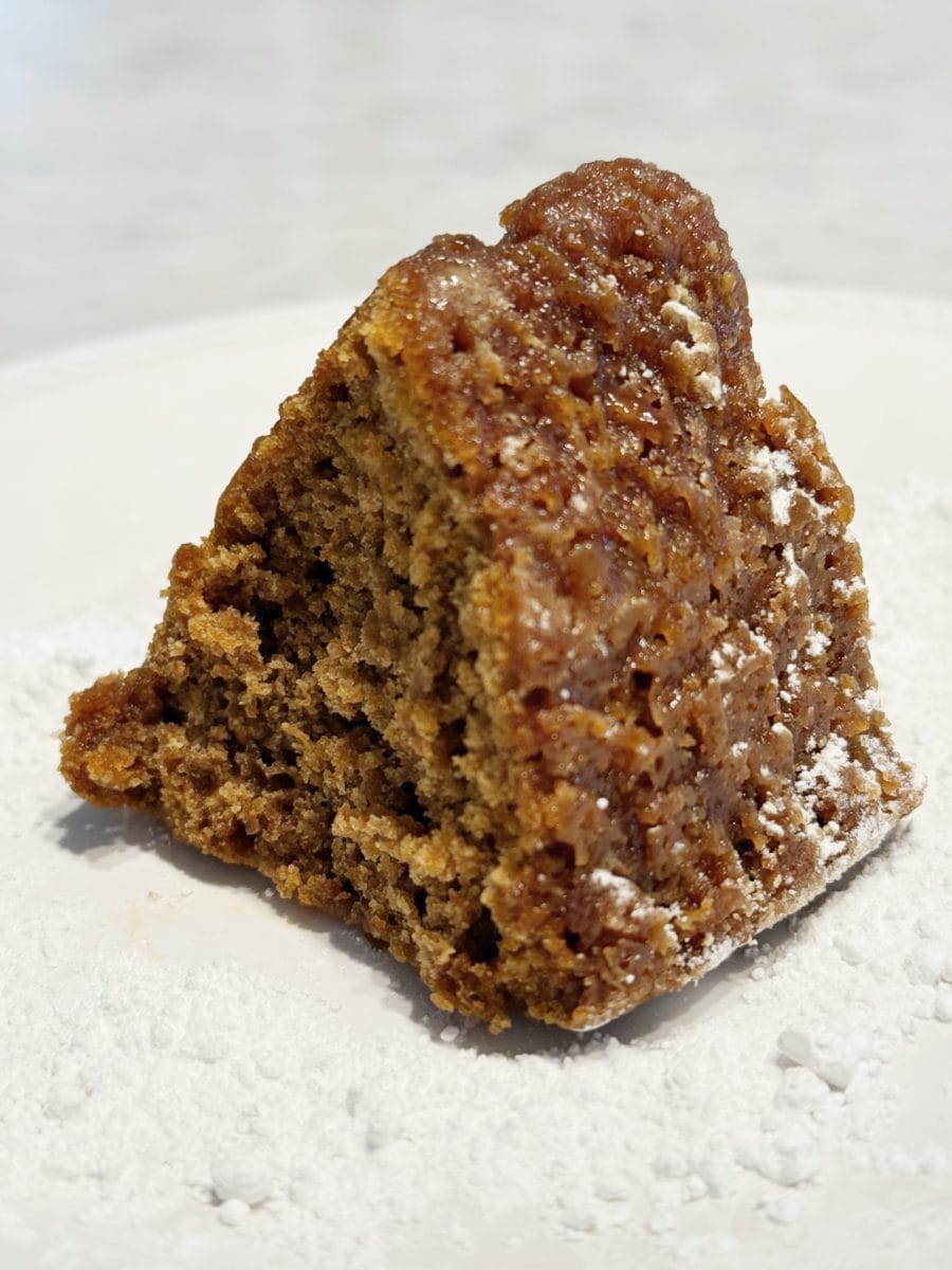 how to paint a gingerbread gift bag 33 a slice of moist brown cake with a slightly crumbly texture sits on a white plate, dusted with powdered sugar.