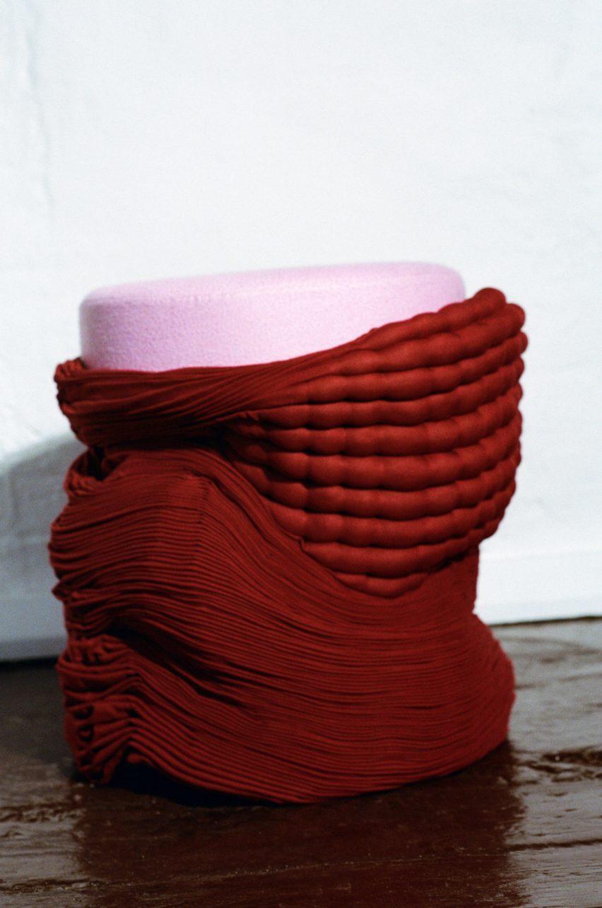 smock stool by tessa silva in red with pink seat