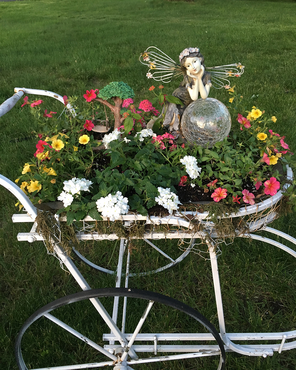 annual flowers in ornamental carriage container