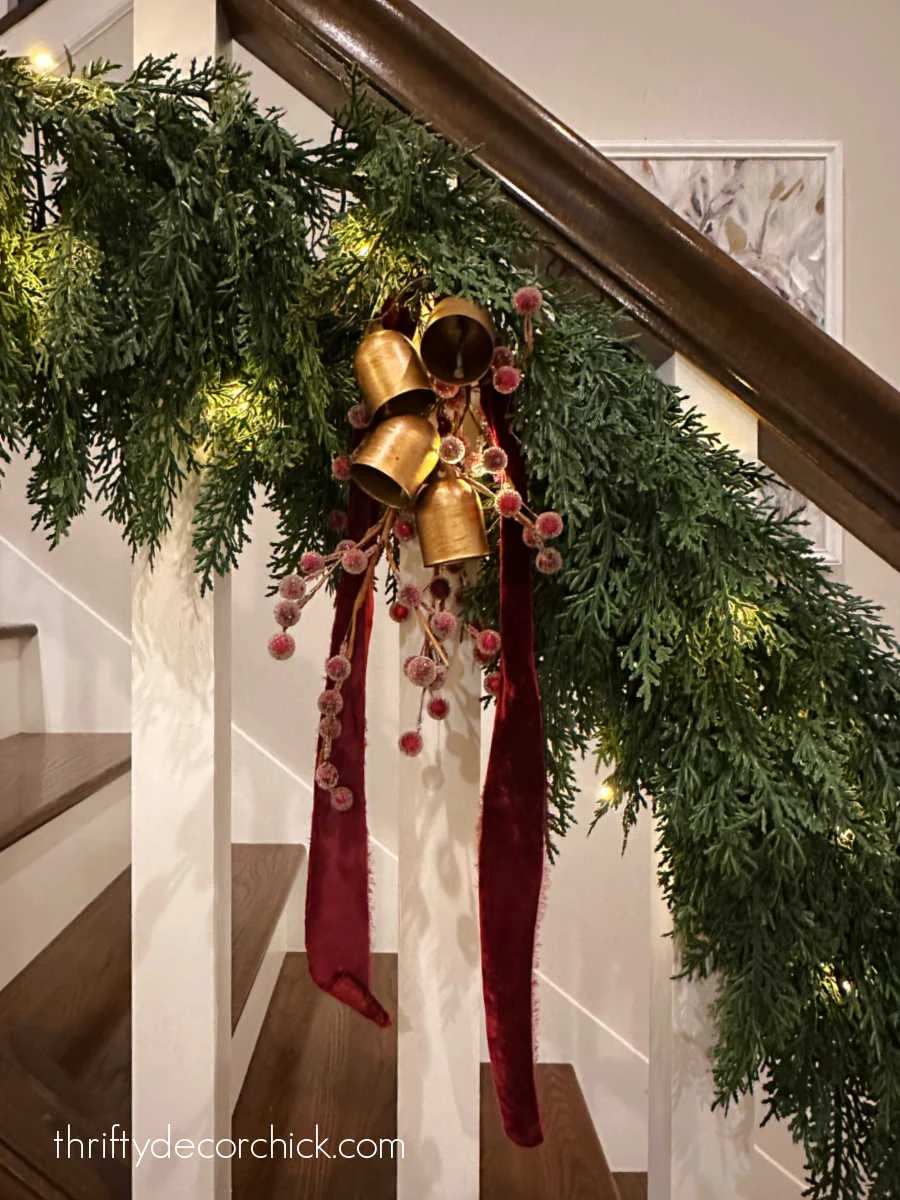 a detailed tour of the christmas decor in our great room | thrifty decor chick 45 bells and berries in stair garland
