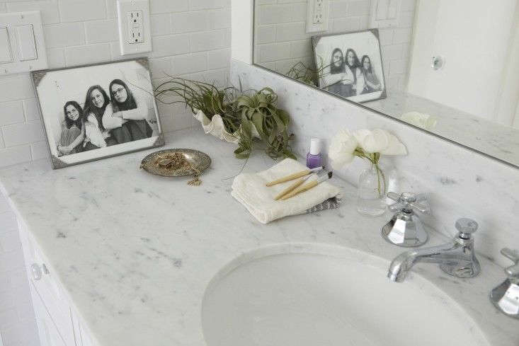 tillandsias need only the occasional water bath to stay alive. keeping them next to a bathroom sink makes giving them a quick dip easy to remember and might discourage the accumulation of too much else. photograph by katie newburn for gardenista.