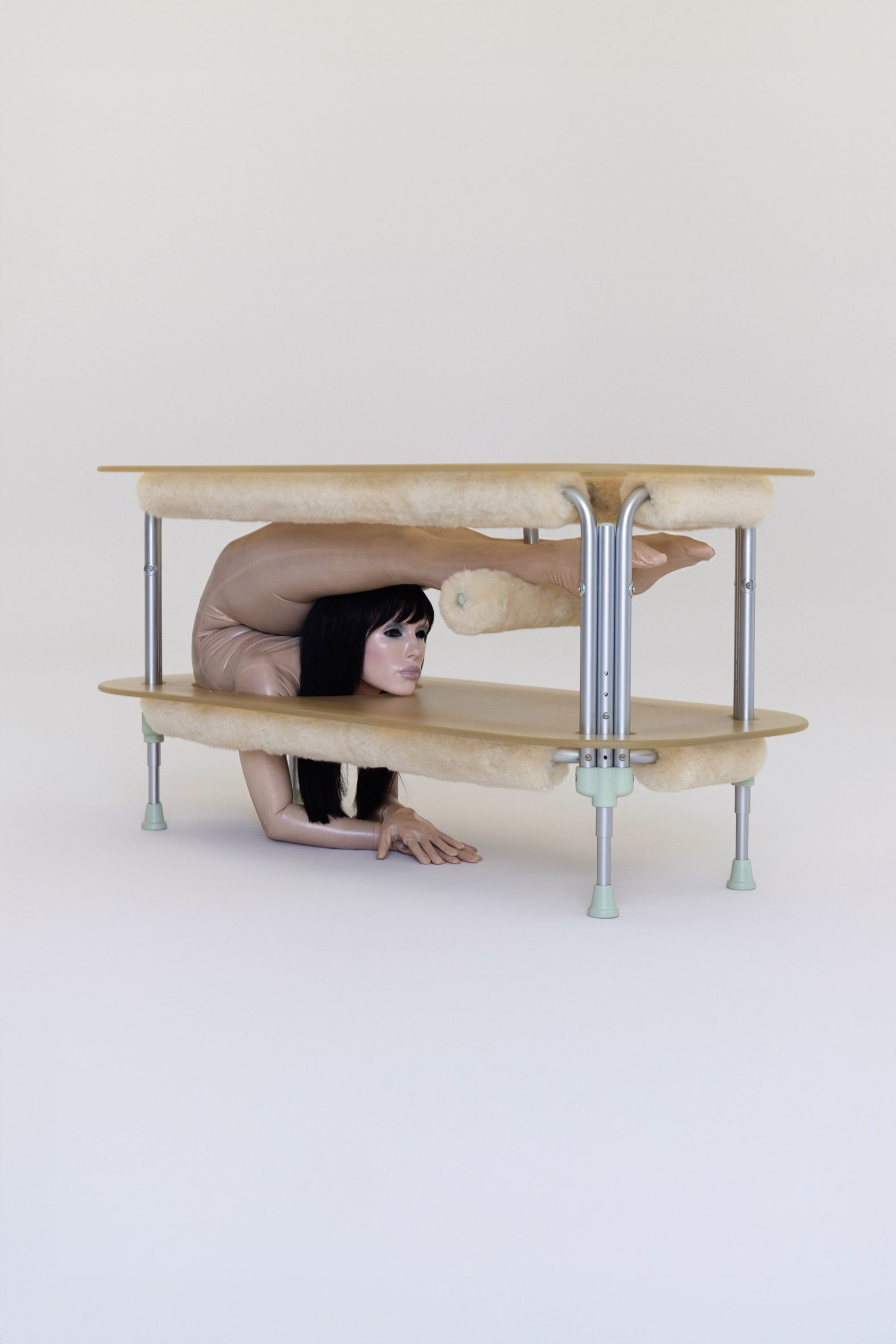 dining table with contorted woman in the base
