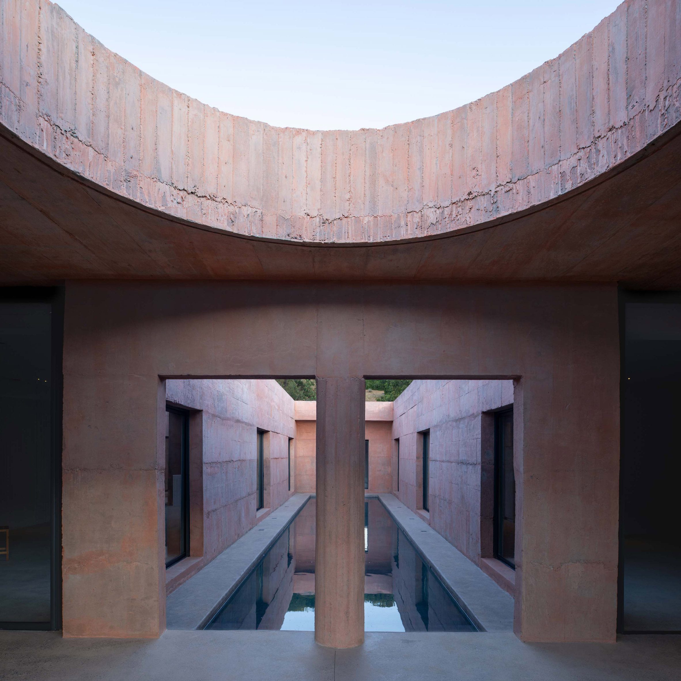 view through to swimming pool in lima house by pezo von ellrichshausen