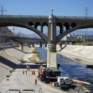 workers digging a hole in the la river