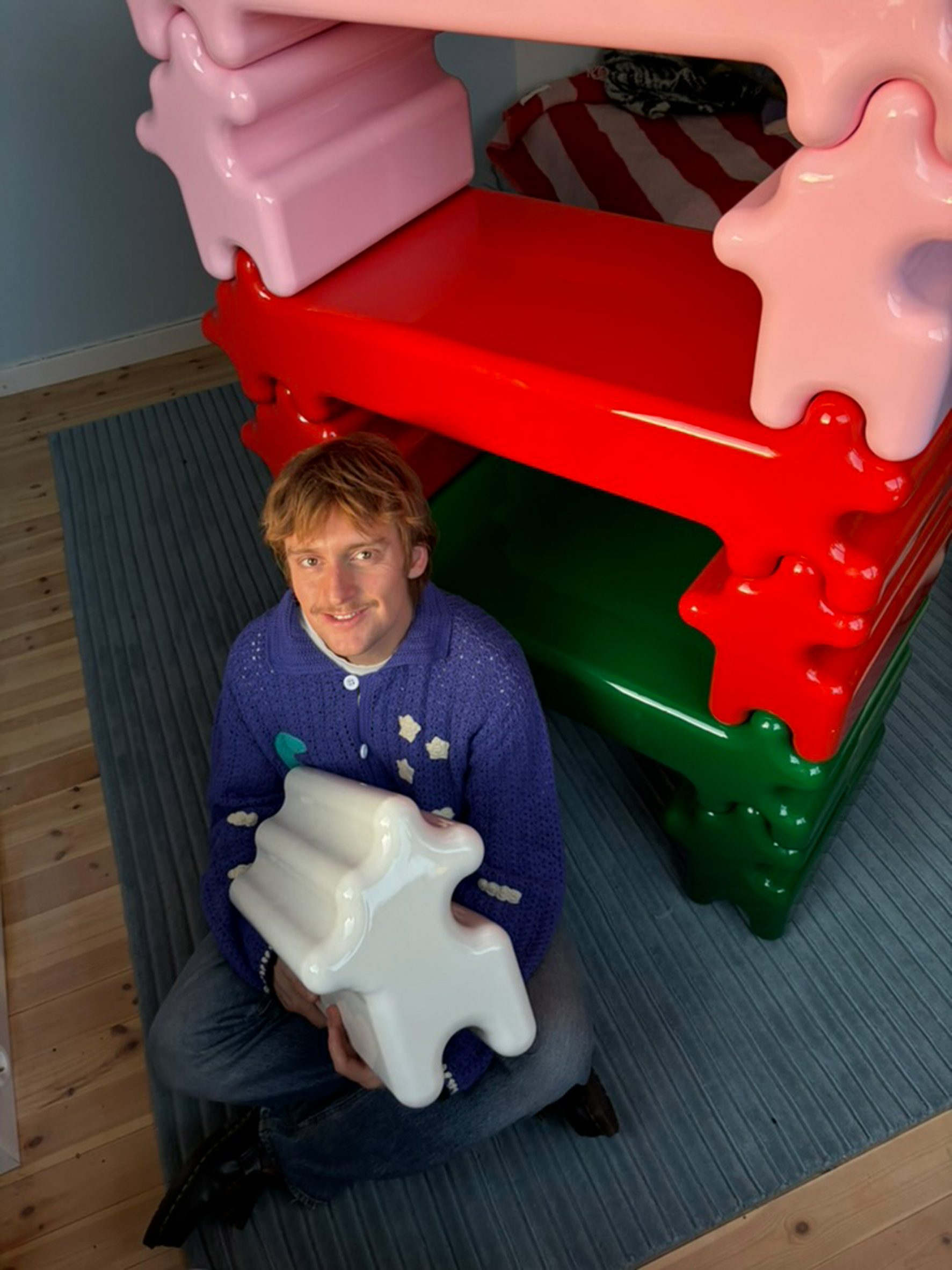 gustaf westman-designed shelving shaped like a jigsaw puzzle