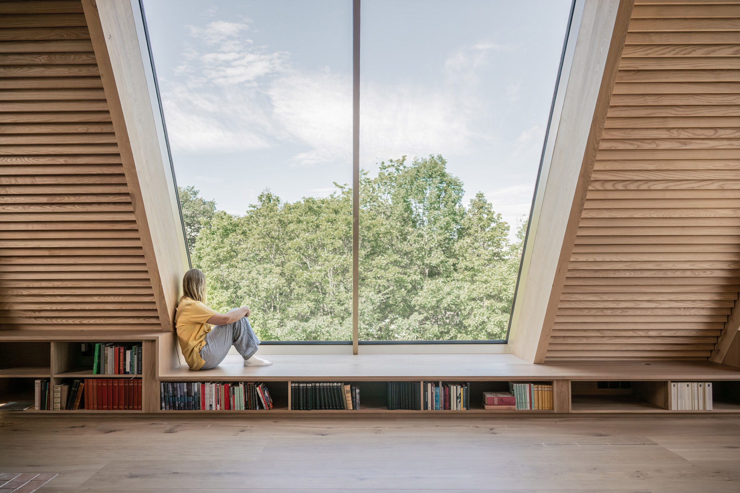 person sitting in window seat