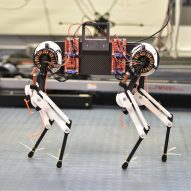 a robot with four legs and a computer body